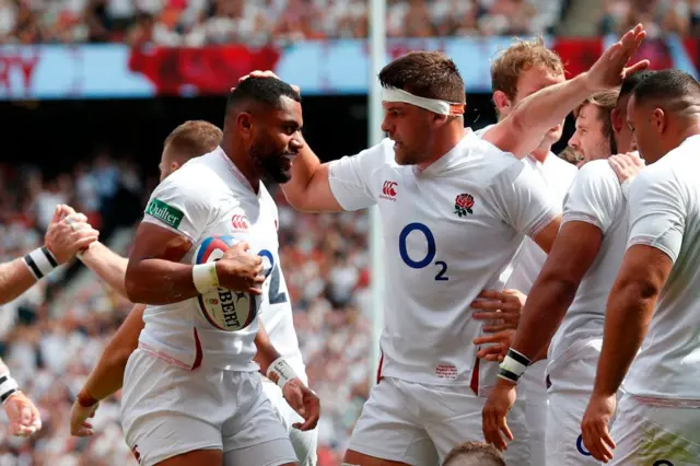 Joe Cokanasiga is congratulated by team-mates