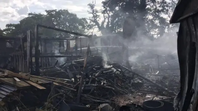 The smouldering shell of a building