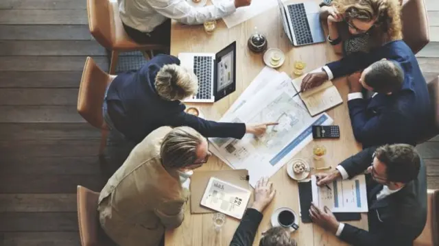 People working on a table