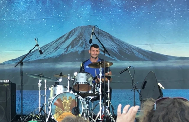 Jonny May playing the drums