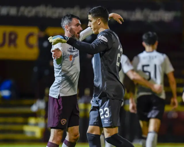 Hearts' Michael Smith and  Joel Pereira celebrate at Fir Park