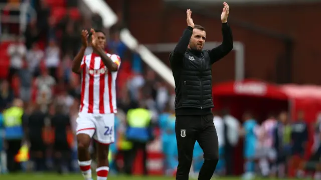 Stoke City manager applauding fans after latest game