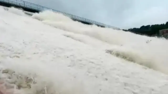 Water pouring down dam wall