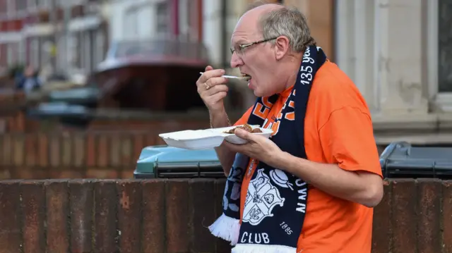 Luton fan eats a pie