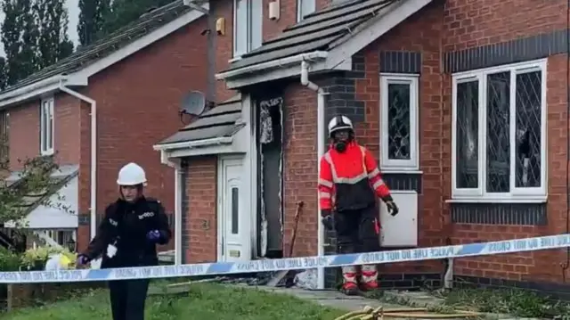 Two people at the scene of the fire