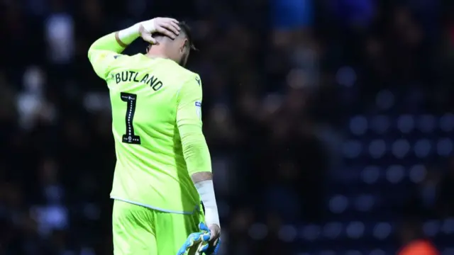 Butland holding head during game