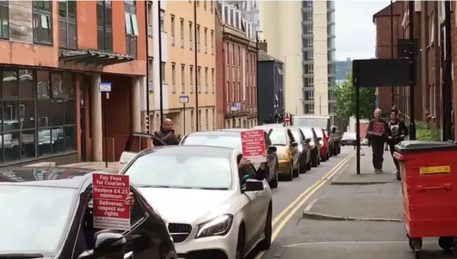 Couriers blocking the road in Sheffield