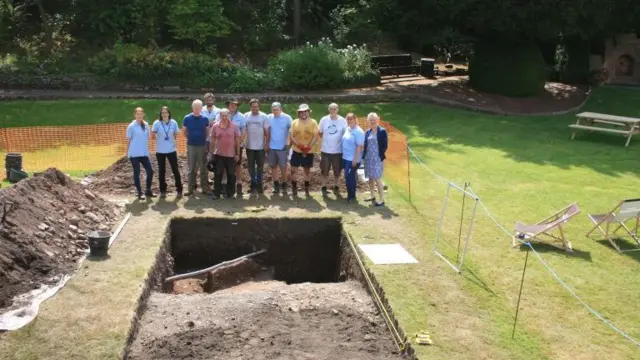 Archaeologists around the excavation