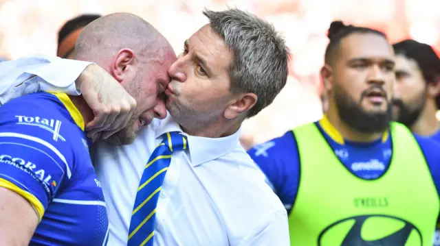 Steve Price kisses captain Chris Hill on the head