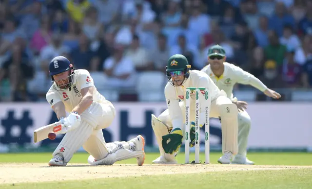 England batsman Jonny Bairstow sweeps a ball for runs watched by Tim Paine during day four of the 3rd Ashes Test Match between England and Australia at Headingley