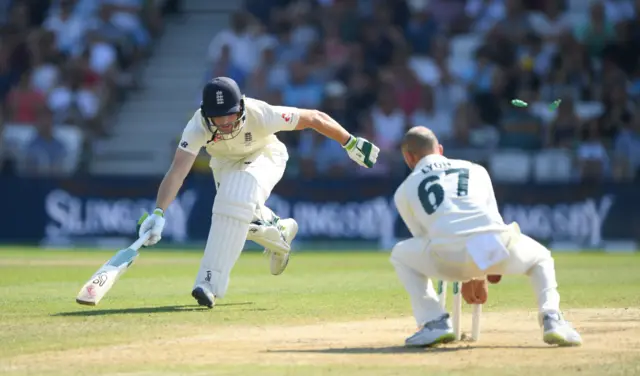 England batsman Jos Buttler is run out from a direct throw from Travis Head