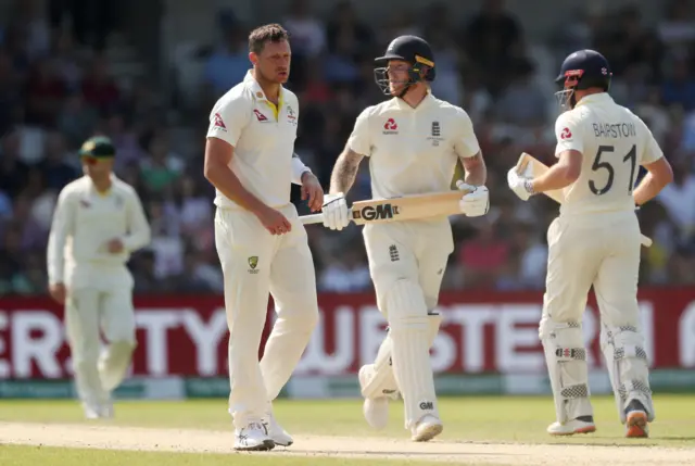 Australia's James Pattinson reacts as England's Ben Stokes looks on