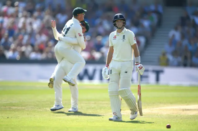 England batsman Joe Root leaves the field after being caught by David Warner