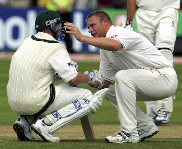 England's Andrew Flintoff (R) consoles Australian Brett Lee after England beat Australia by just two runs to win the Second Test at Edgbaston cricket ground