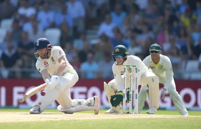 England batsman Jonny Bairstow sweeps a ball for runs watched by Tim Paine during day four of the 3rd Ashes Test Match between England and Australia at Headingley