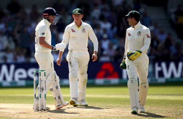 Jonny Bairstow speaks with Australia"s Tim Paine (right) after he successfully appeals against being given out during day four of the third Ashes Test match at Headingley