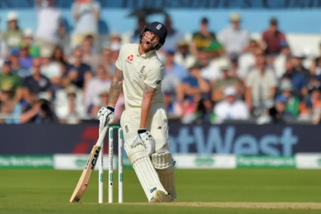 Ben Stokes reacts after being struck on the knee