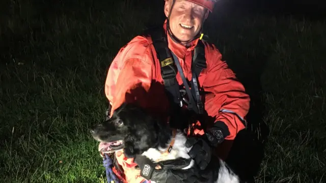 Firefighter with one of the dogs