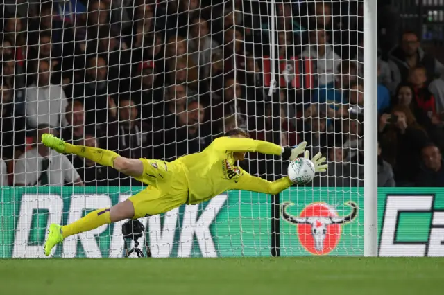 Mark Travers saves Forest Green penalty