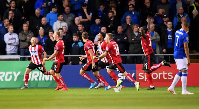 Lincoln celebrate their first goal against Everton