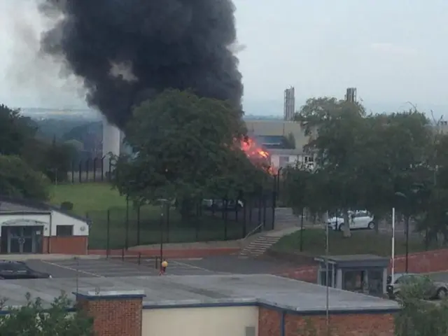 Smoke and flames from the building