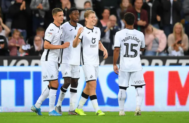 George Byers celebrates scoring Swansea's second goal