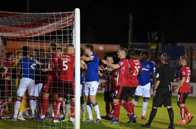 Lincoln and Everton argue in goalmouth