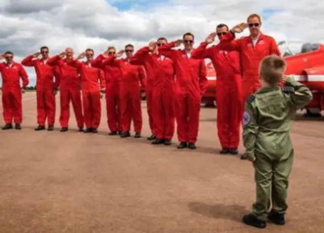 Jacob saluting Red Arrows