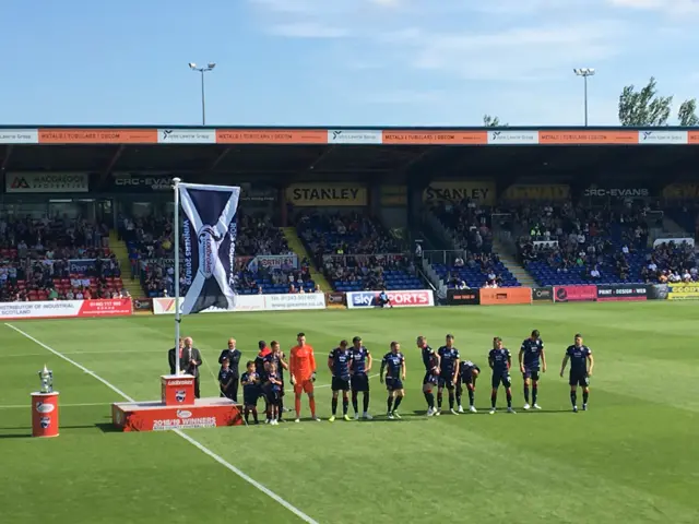 Ross County celebrate with the Scottish Championship flag