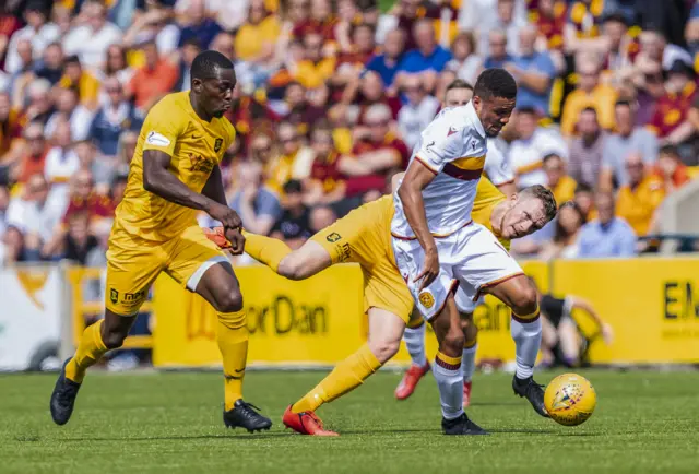 Livingston's Marvin Bartley in action with Motherwell's Jermaine Hylton