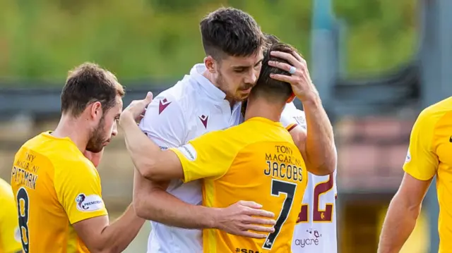 Motherwell's Declan Gallagher (L) with former teammate, Livingston's Keaghan Jacobs at full-time