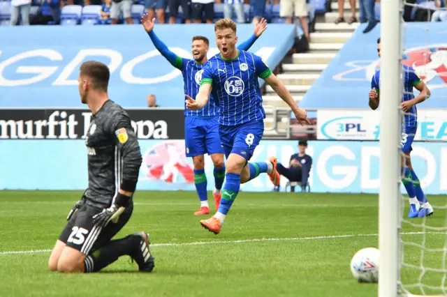 Lee Evans celebrates his winner for Wigan