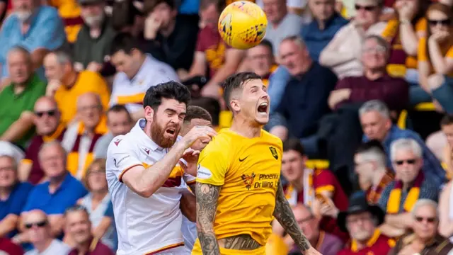 Motherwell's Liam Donnelly in action with Livingston's Lyndon Dykes