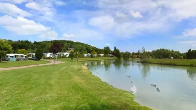 Campsite with a lake in the foreground