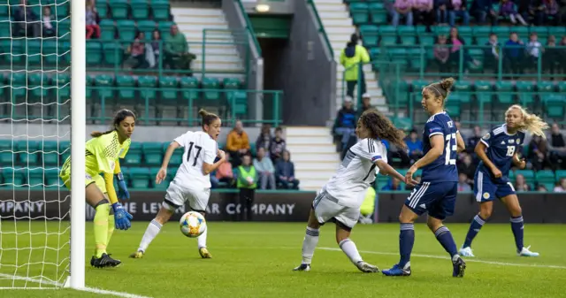 Scotland’s Claire Emslie (right) watches as her header gives the home side the lead