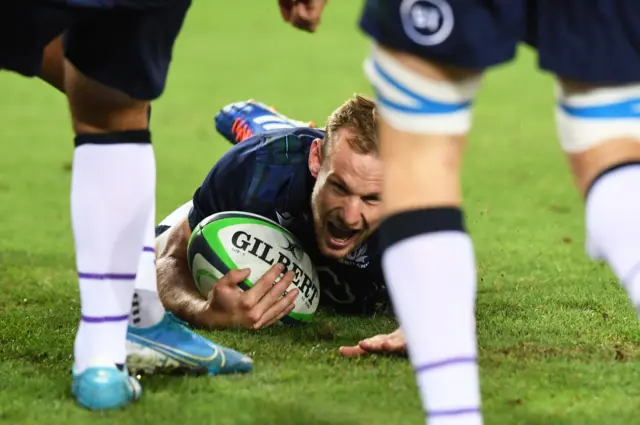 Rory Hutchinson slides over for his first Scotland try