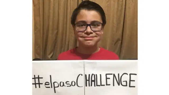 Boy holding sign reading #elpasochallenge