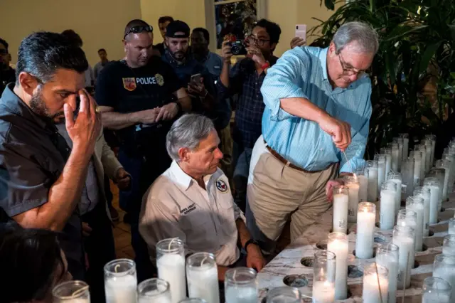 Mayor Margo lights candles alongside Texas Governor Greg Abbott