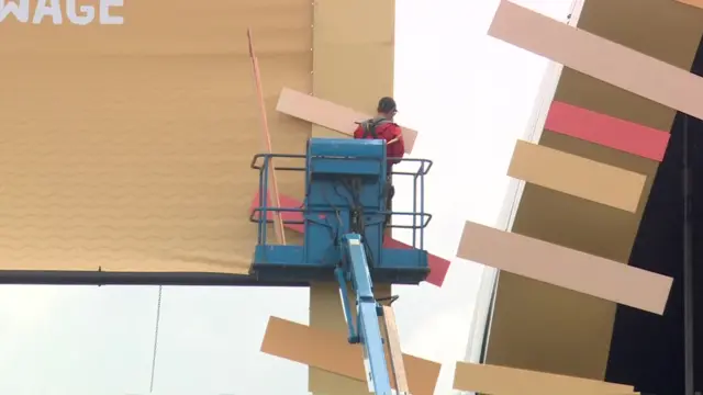 worker dismantling the main stage