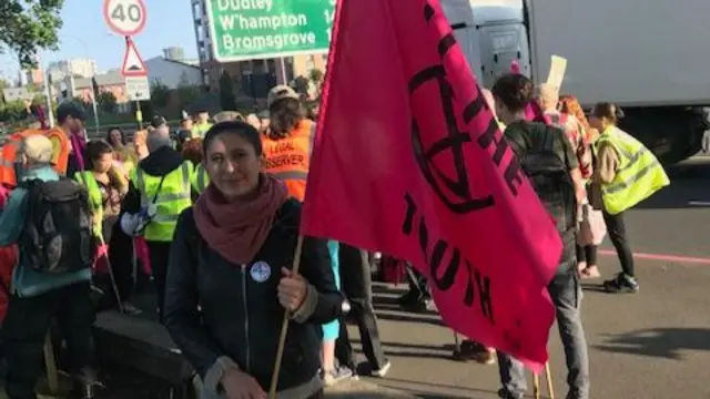 One of the protesters holding a flag