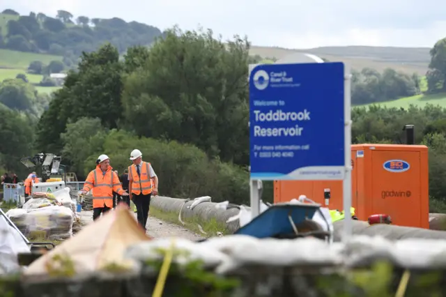 Engineers at reservoir