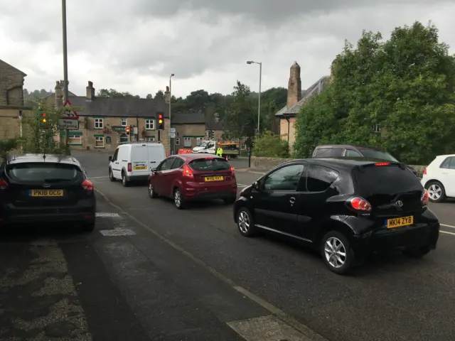 Cars on road into Whaley Bridge