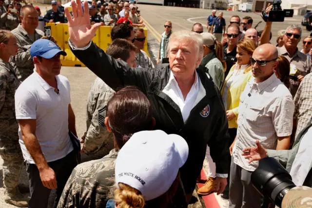 President Donald Trump and the First Lady arrive at the Muniz Air National Guard Base in Carolina, Puerto Rico in 2017.