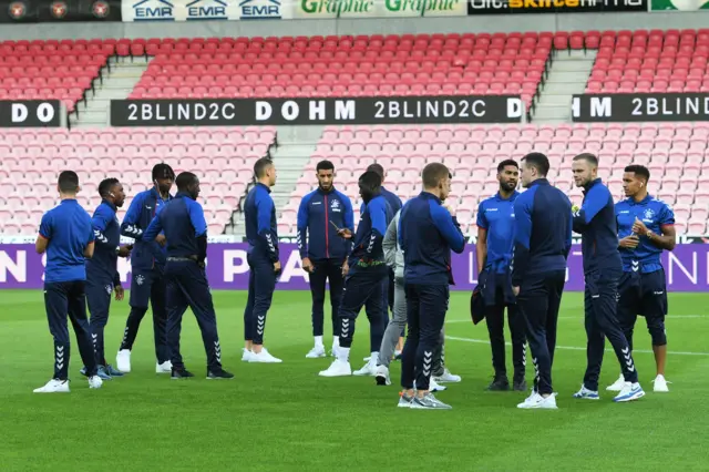 The Rangers players take to the field ahead of kick off