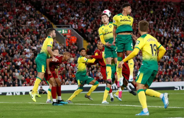 Virgil van Djik holds off Jamal Lewis ahead of his headed third goal