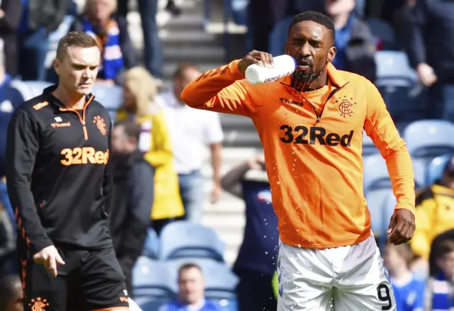 Jermain Defoe takes a quick pre-match drink during the warm-up at Ibrox