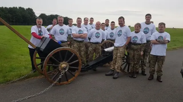 Servicemen and women with the gun