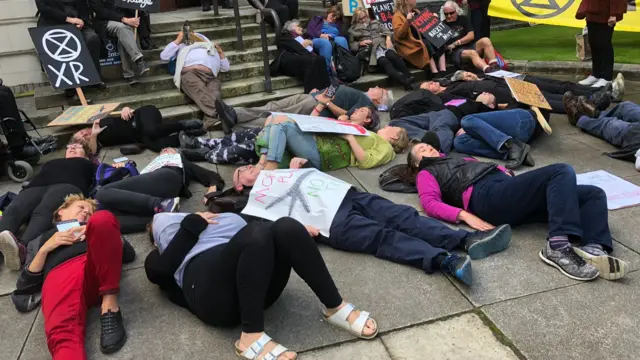 Protesters lying on the floor