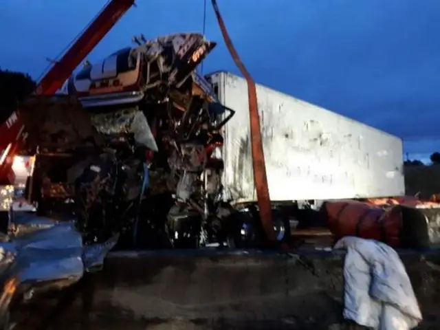 Lorry being lifted from carriageway