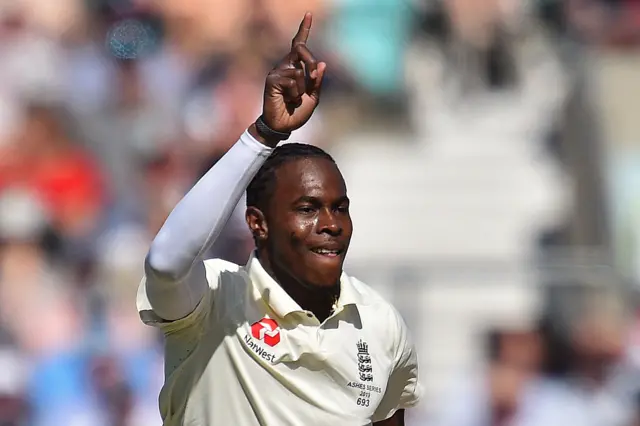 England's Jofra Archer celebrates taking the wicket of Australia's Marcus Harris (unseen) for three runs during play on the second day of the fifth Ashes cricket Test match between England and Australia at The Oval